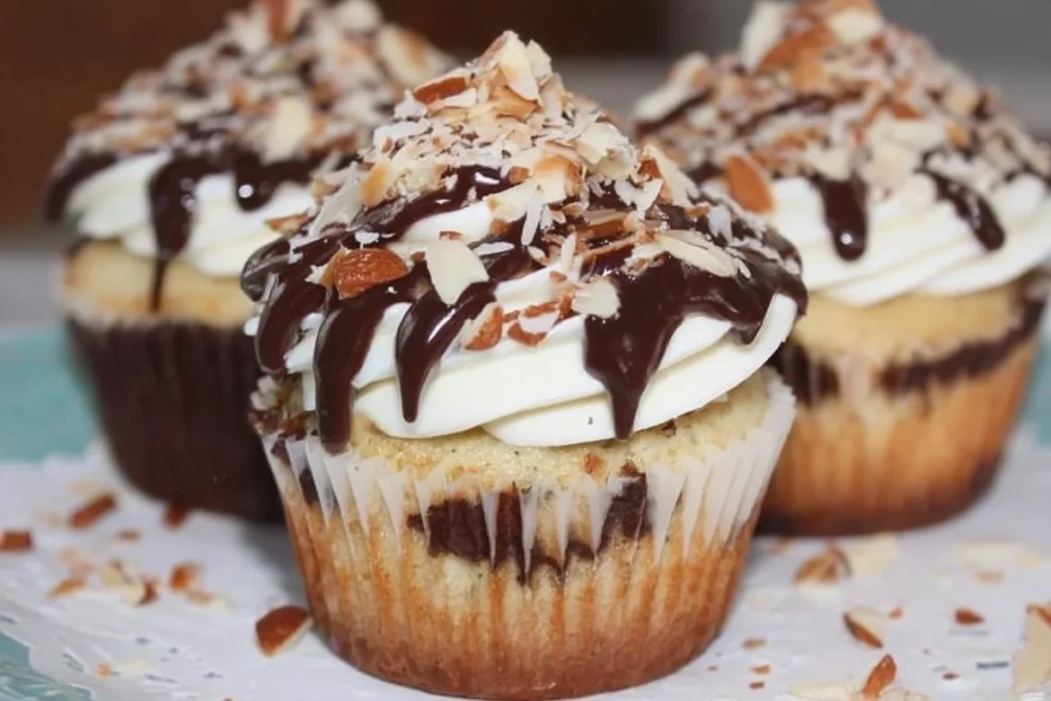 Delicious Almond Joy Cupcakes topped with chocolate, coconut, and almonds.