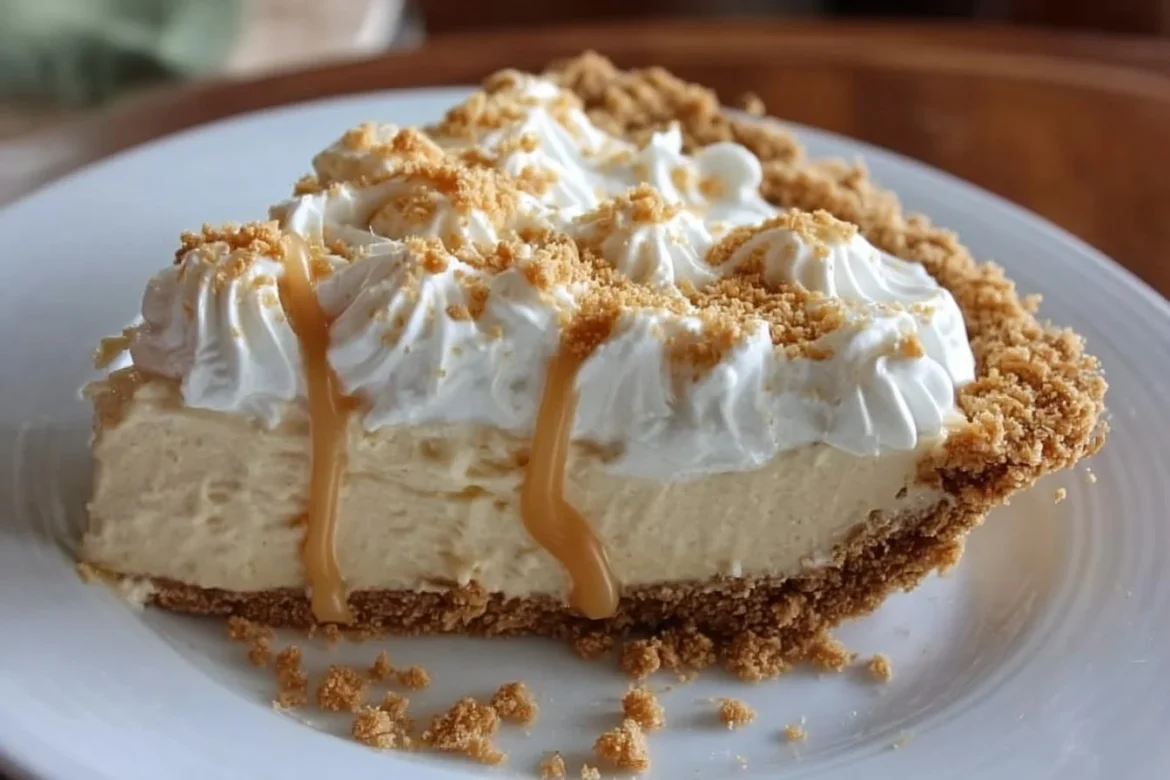 Delicious Amish Peanut Butter Cream Pie topped with whipped cream and chocolate drizzle.