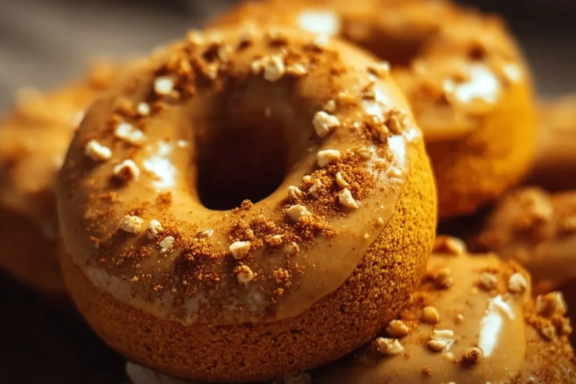 A delicious batch of homemade Pumpkin Spice Donuts topped with cinnamon and sugar.