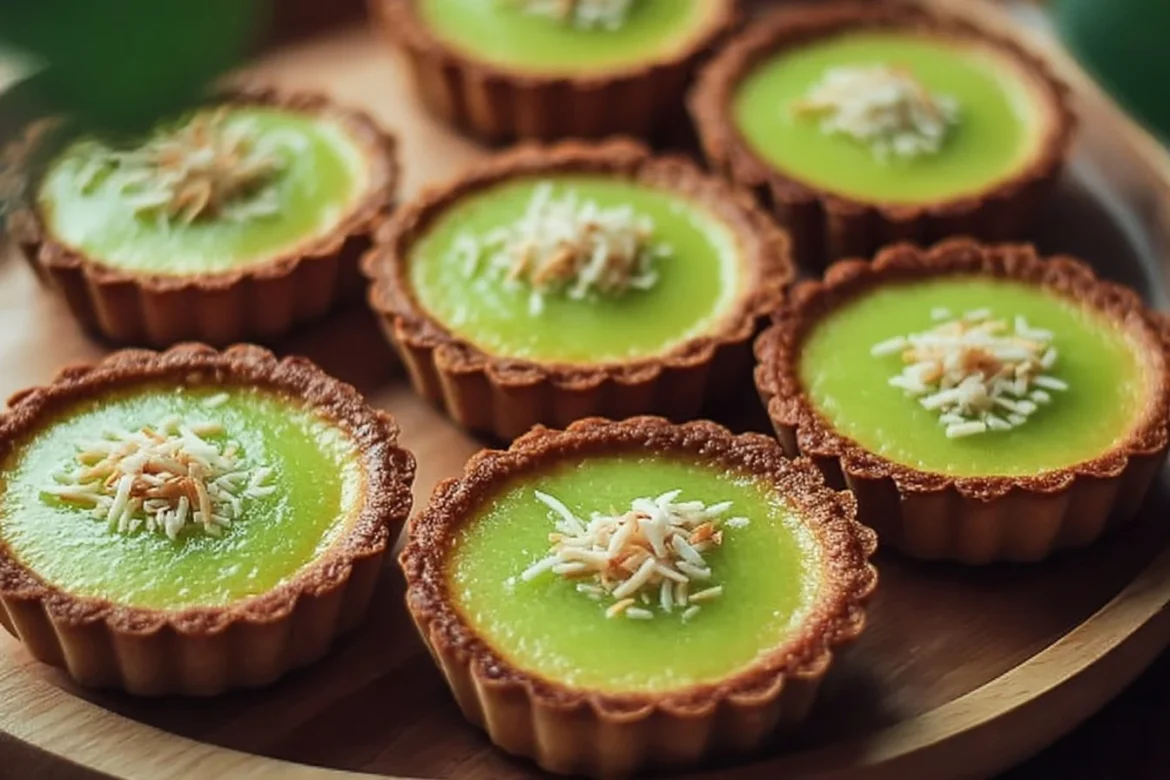 Thai Pandan Coconut Tarts topped with creamy coconut filling and pandan color