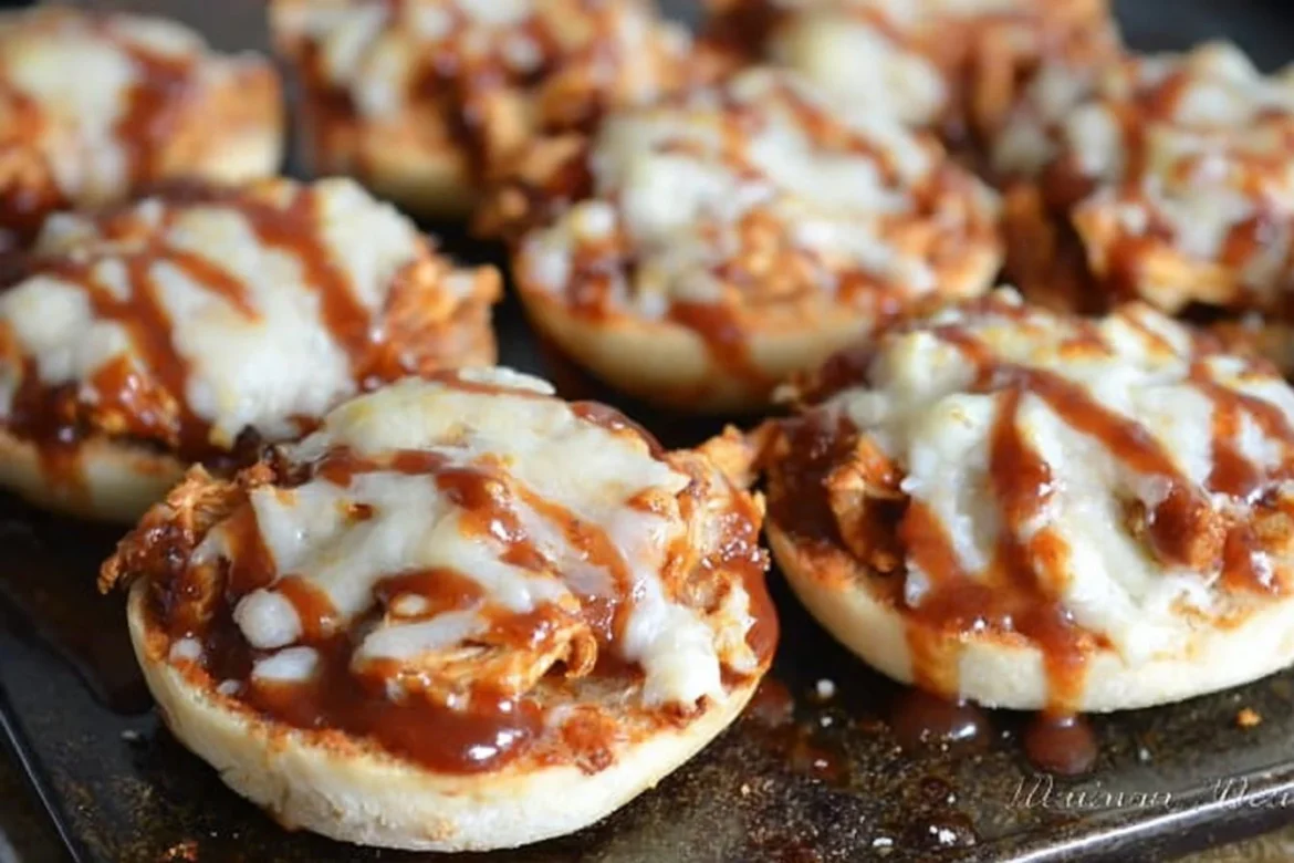 Asiago BBQ Chicken Bagel Bites topped with cheese and BBQ sauce