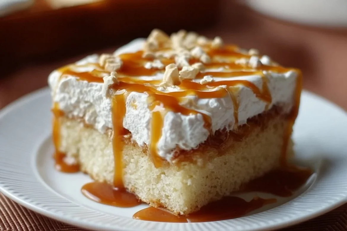Delicious Caramel Three Milks Cake topped with caramel sauce and whipped cream.