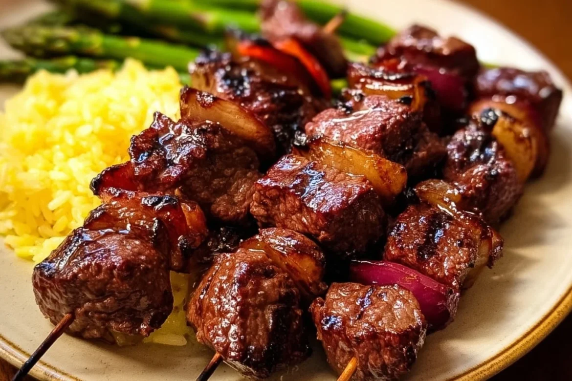 Healthy grilled teriyaki steak kabobs served with vegetables on skewers