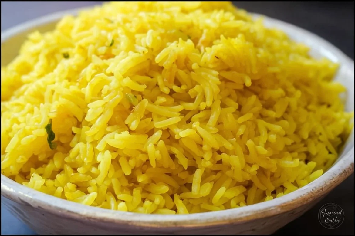 Bowl of Mediterranean yellow rice garnished with spices and herbs