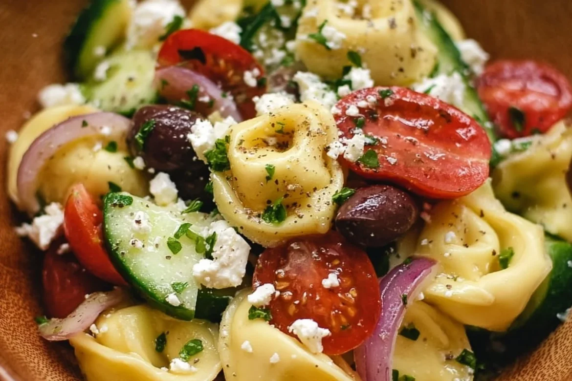 Zesty Greek tortellini salad with fresh vegetables and feta cheese