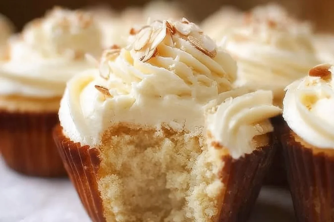 Delicious Almond Amaretto Cupcakes with frosting and almonds on top