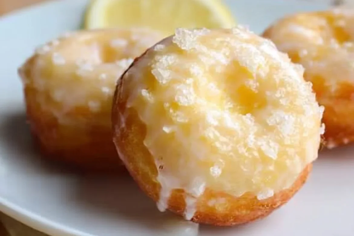 Delicious baked lemon donut on a plate topped with lemon glaze