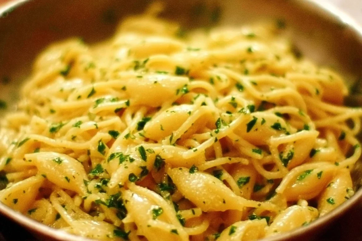 Cheesy Garlic Butter Noodles garnished with herbs and cheese