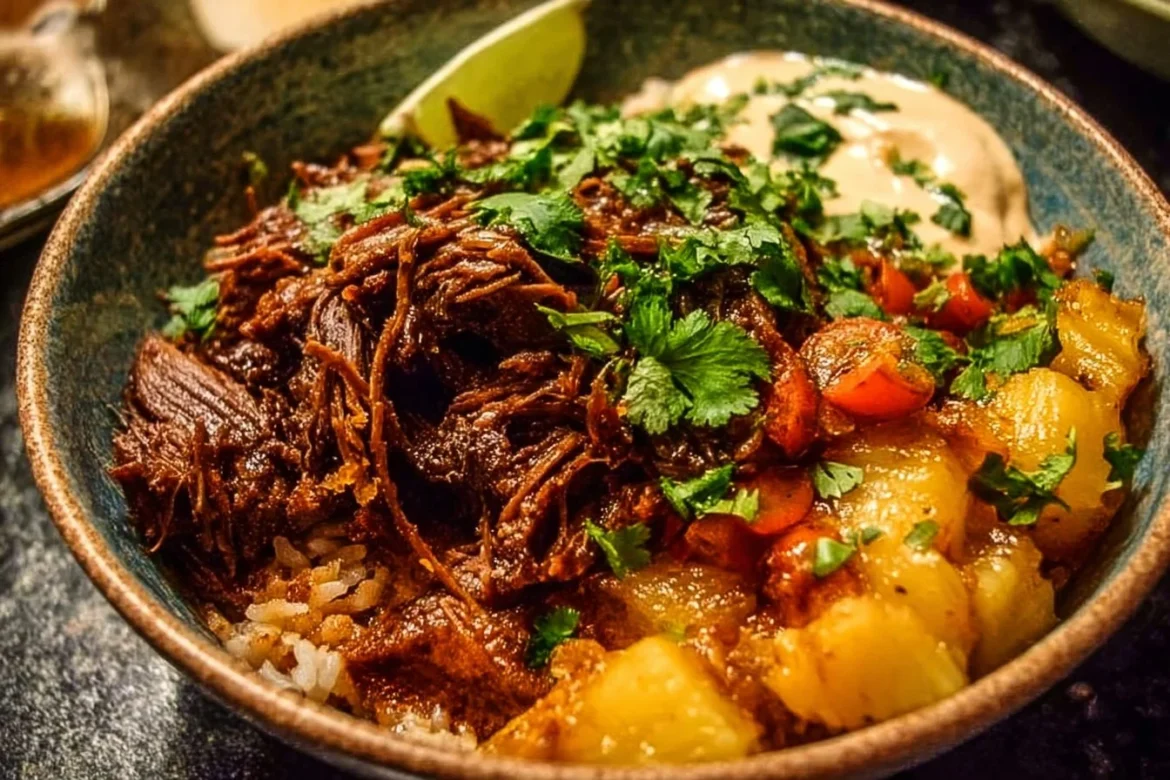 Crockpot Chipotle Pineapple Pot Roast Bowl garnished with fresh herbs