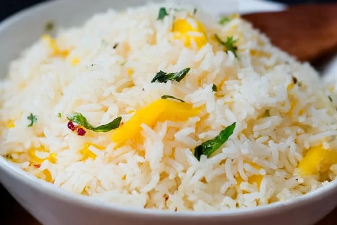Delicious Mango Coconut Rice served in a bowl with fresh mango slices