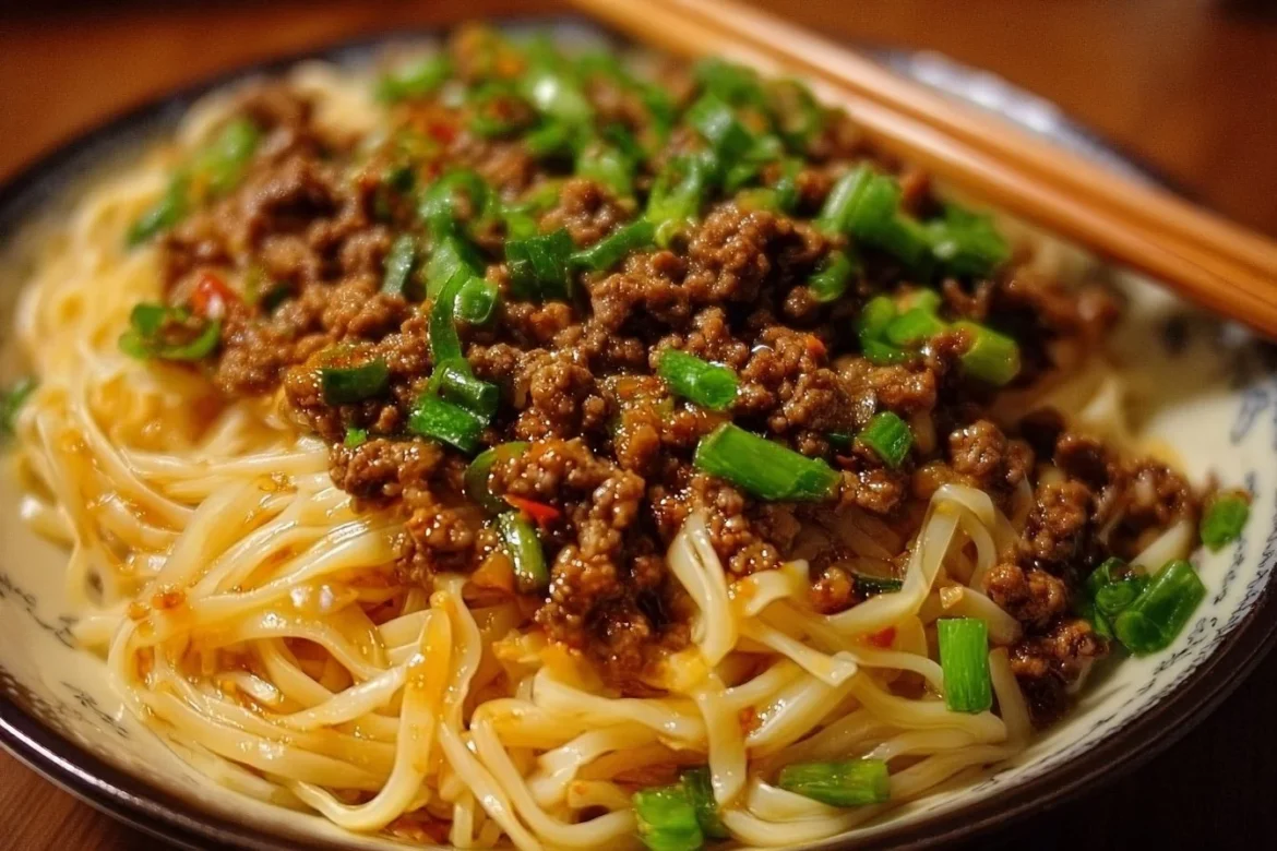 Mongolian ground beef noodles served with vegetables in a savory sauce