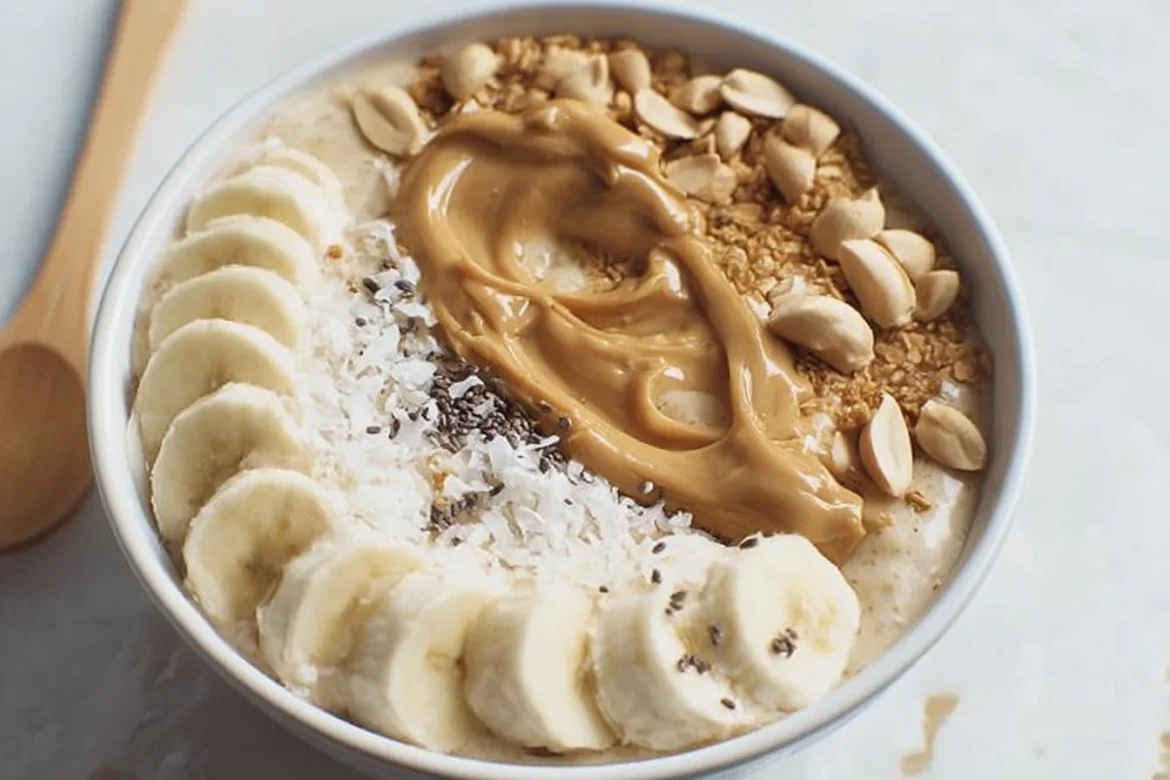 Delicious Peanut Butter Banana Smoothie Bowl topped with fresh fruits and granola
