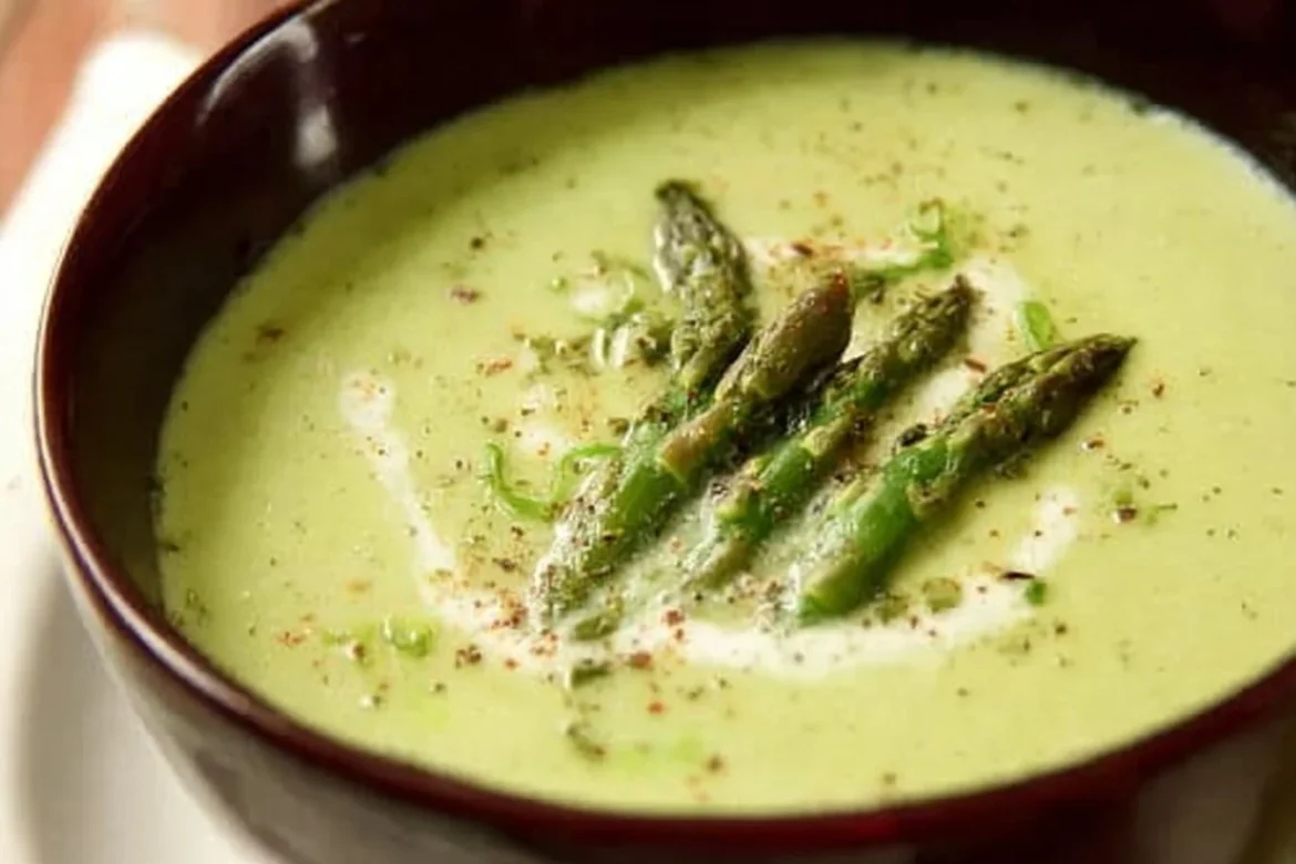 Delicious bowl of Pioneer Woman asparagus soup garnished with herbs