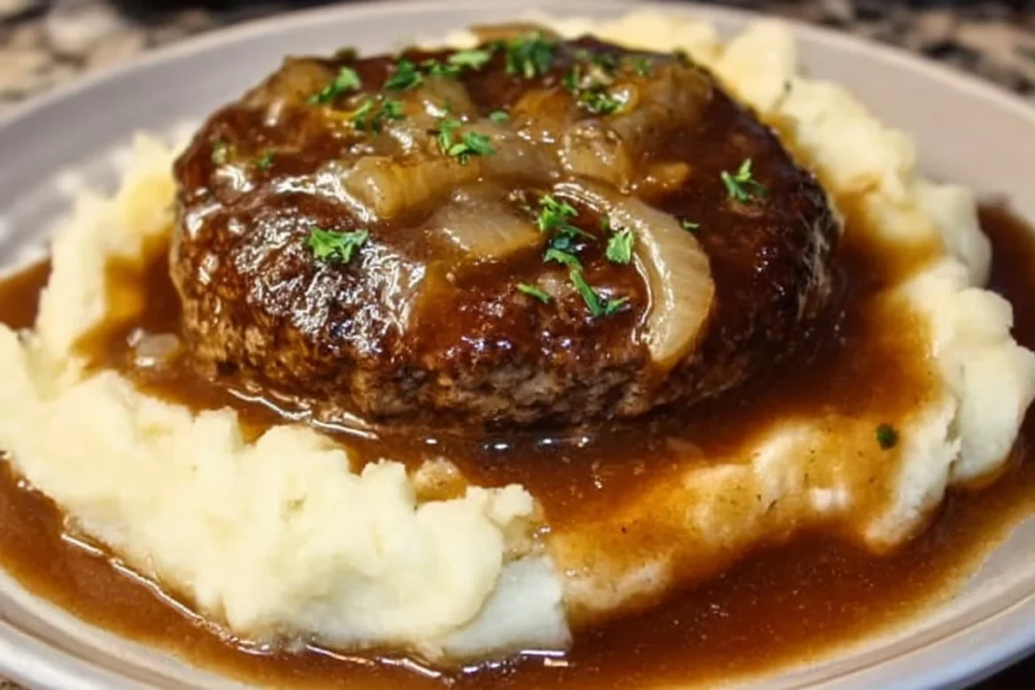Delicious Salisbury steak served with creamy mashed potatoes on a plate.