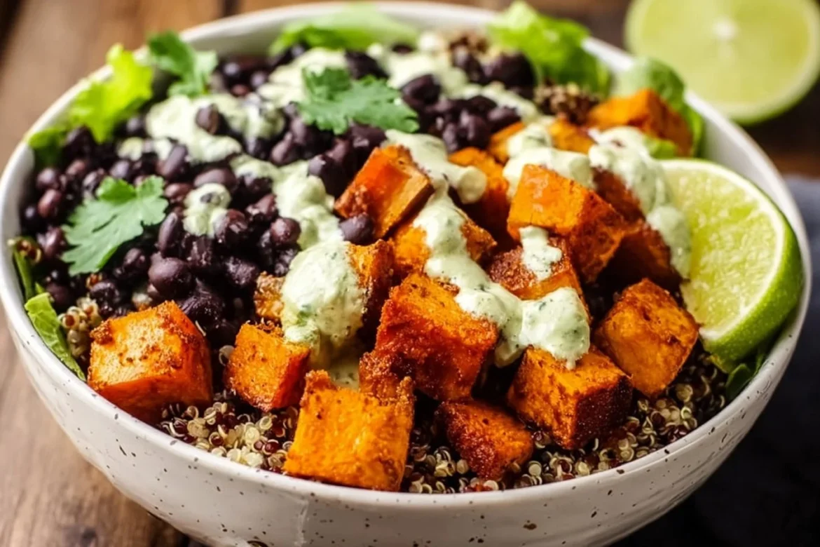 Sweet Potato and Black Bean Quinoa Bowl garnished with fresh herbs