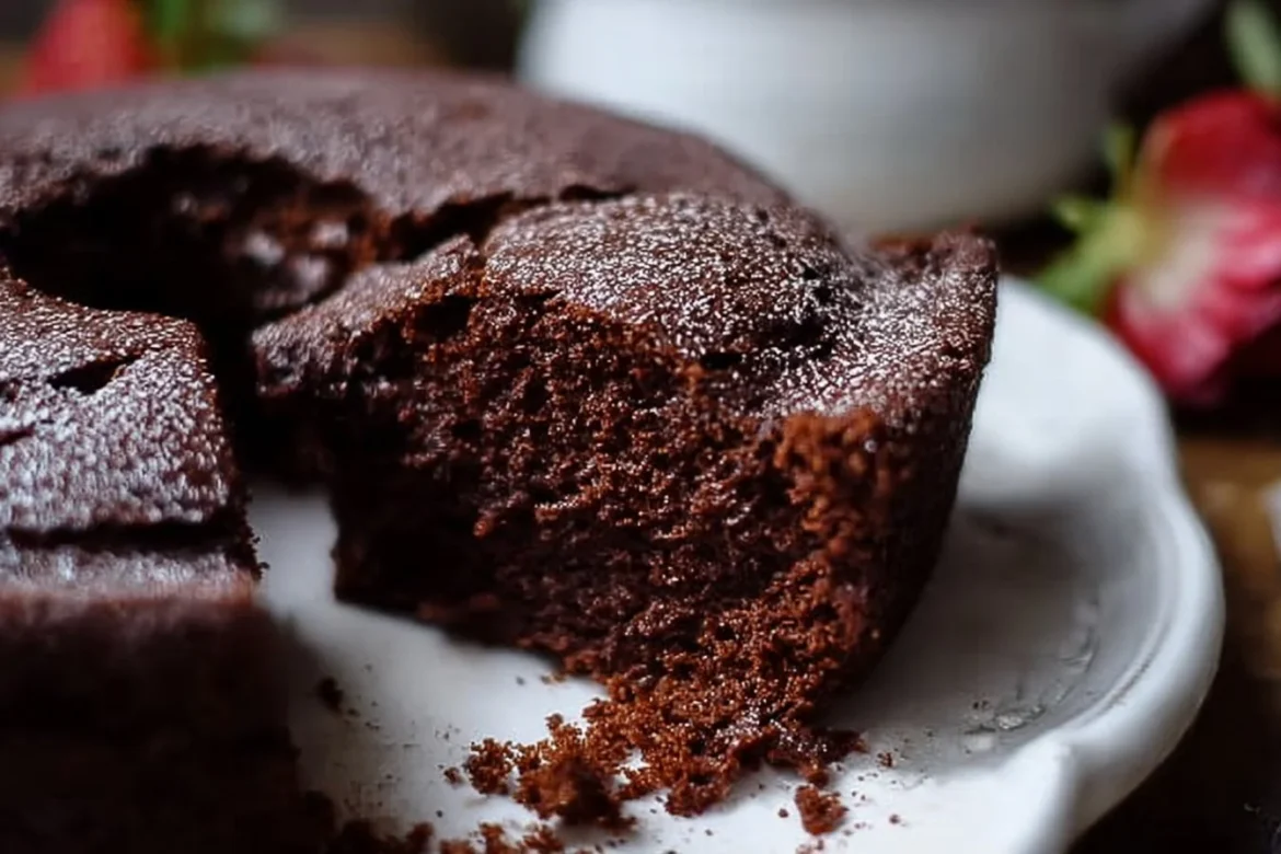 Delicious homemade chocolate ricotta cake topped with chocolate shavings.