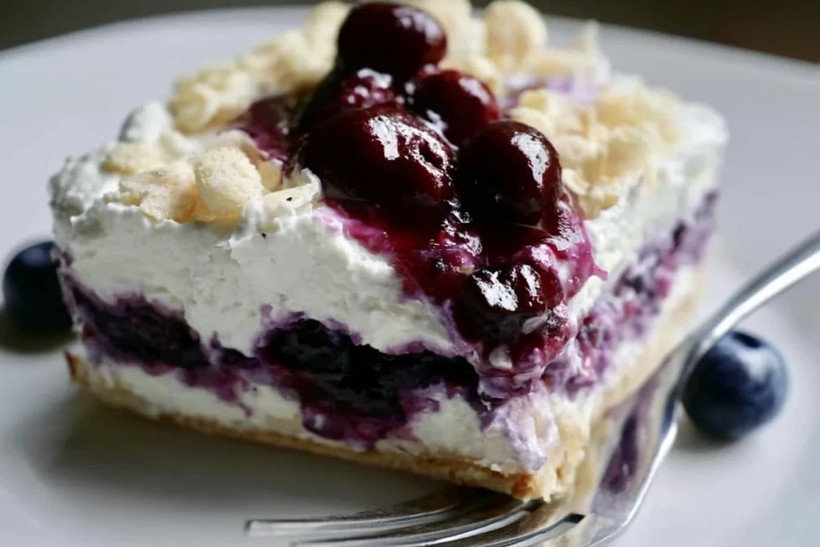Blueberry Cream Cheesecake Lasagna dessert with layers of cream and blueberries