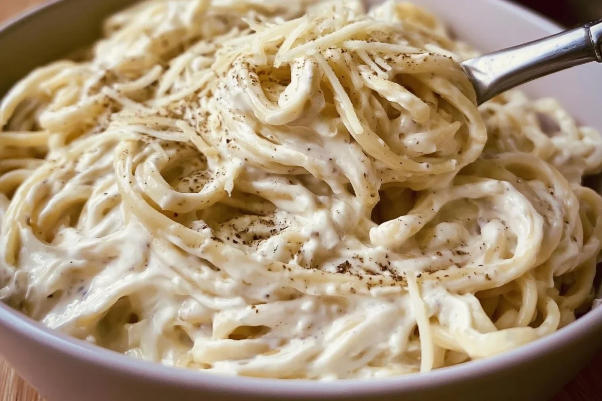 Creamy Cottage Cheese Alfredo dish served with pasta and garnished with herbs