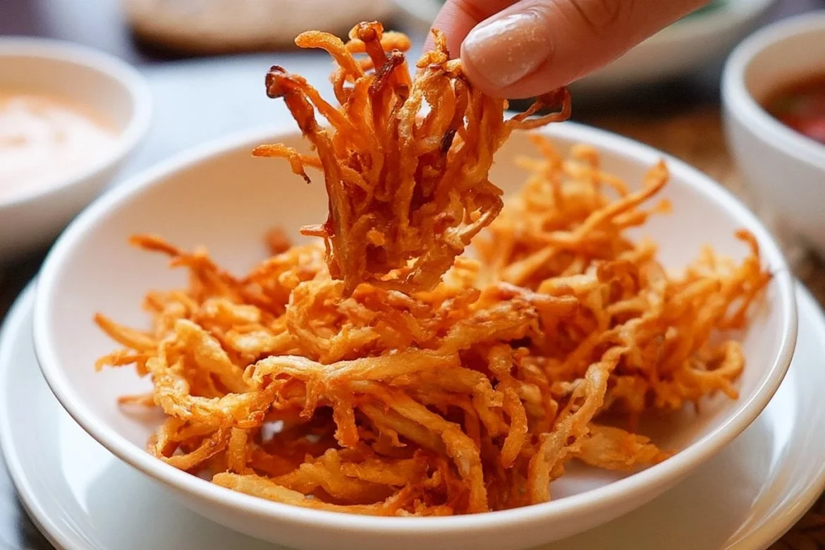 Crispy Fried Enoki Mushrooms served on a plate with dipping sauce