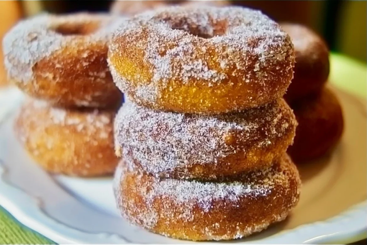 Freshly baked Pumpkin Cake Donuts with fall spices and glaze