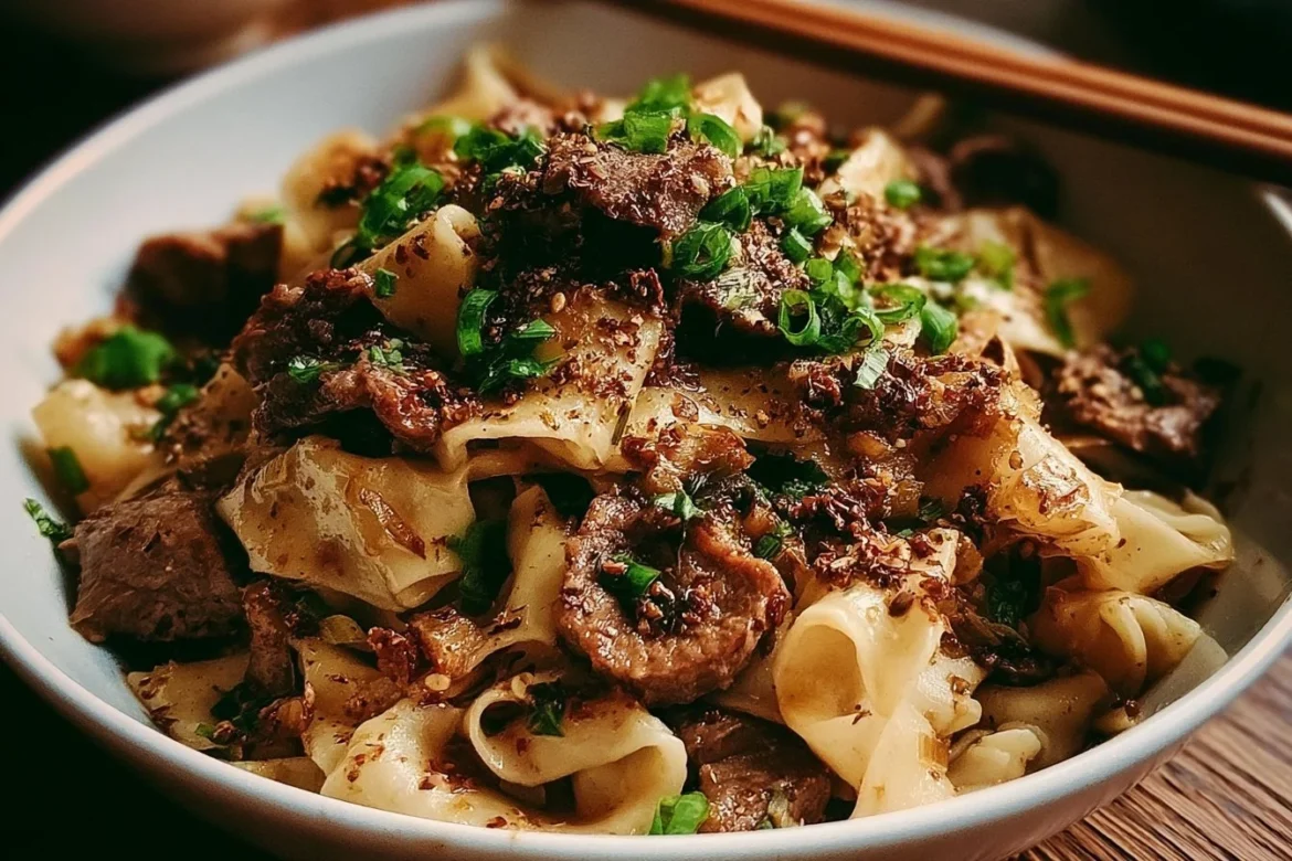 Delicious restaurant-style cumin lamb noodles served with vibrant vegetables.
