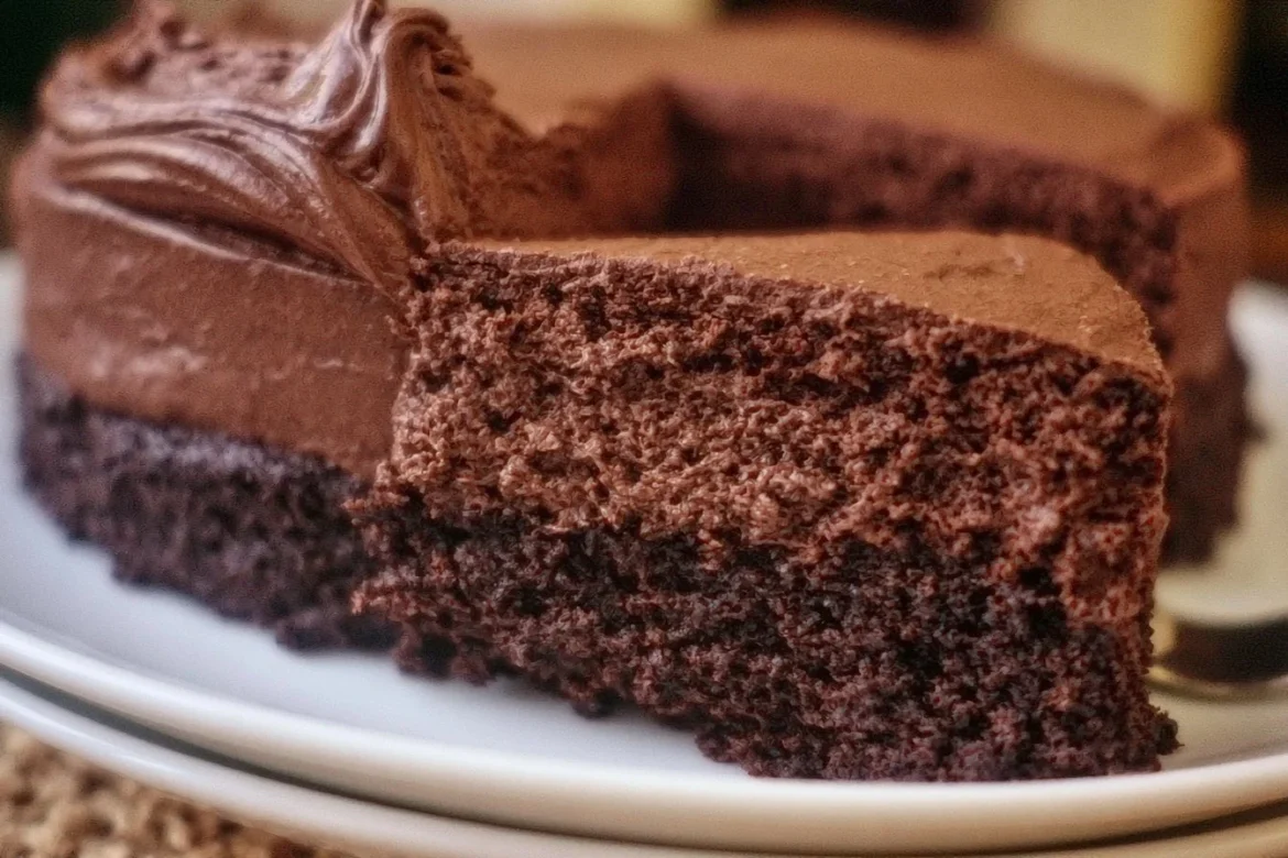 Delicious French Silk Chocolate Cake topped with chocolate curls.