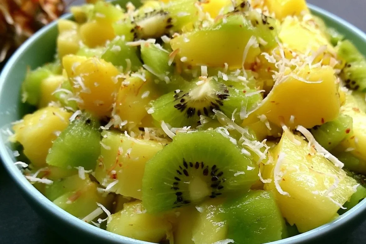 Fresh Pineapple Kiwi Salad with vibrant fruits in a bowl.