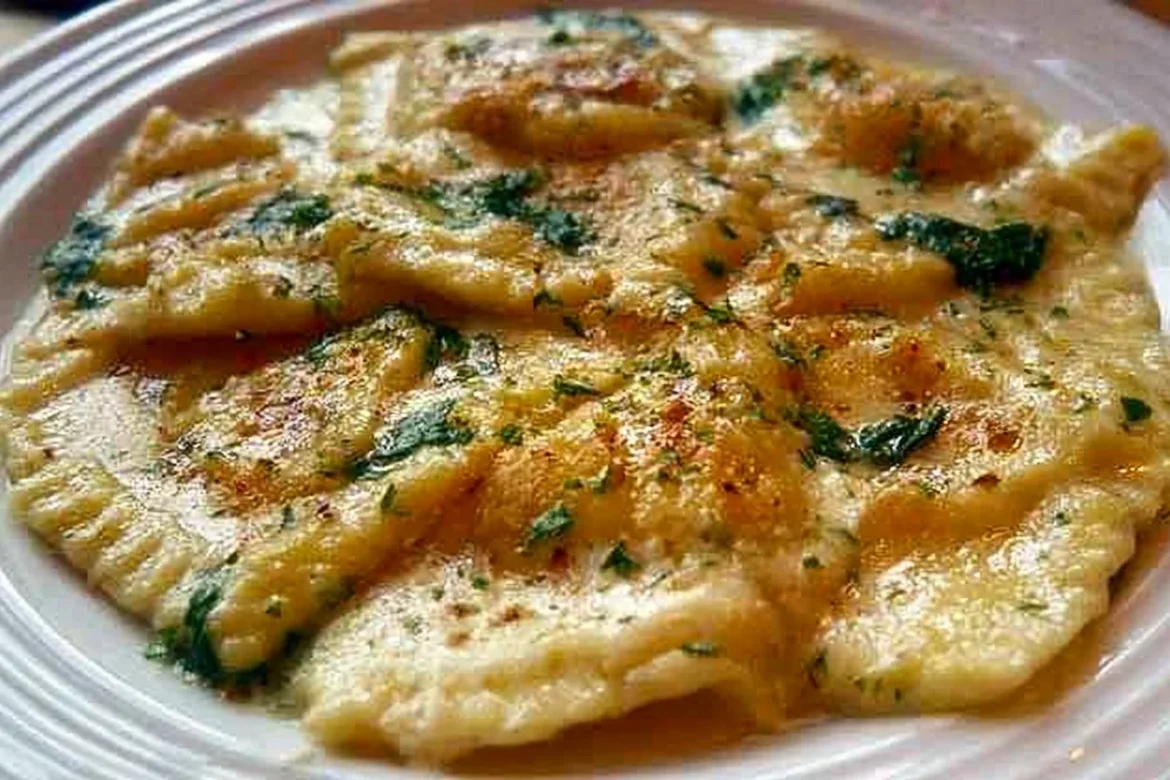 Plate of delicious roasted garlic ravioli topped with herbs and Parmesan cheese