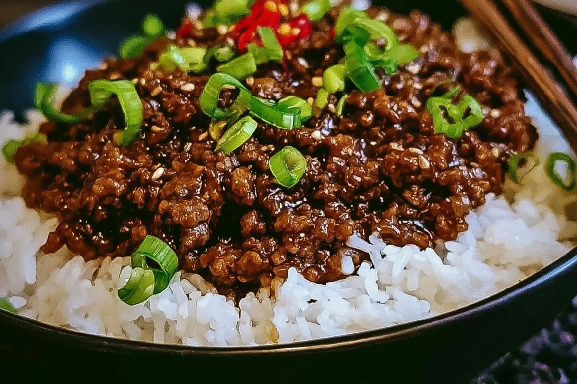 Sticky Ginger Beef Mince served in a bowl with fresh herbs