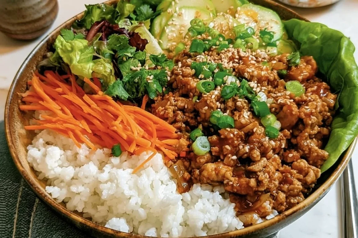 Delicious chicken lettuce wrap bowls topped with fresh vegetables