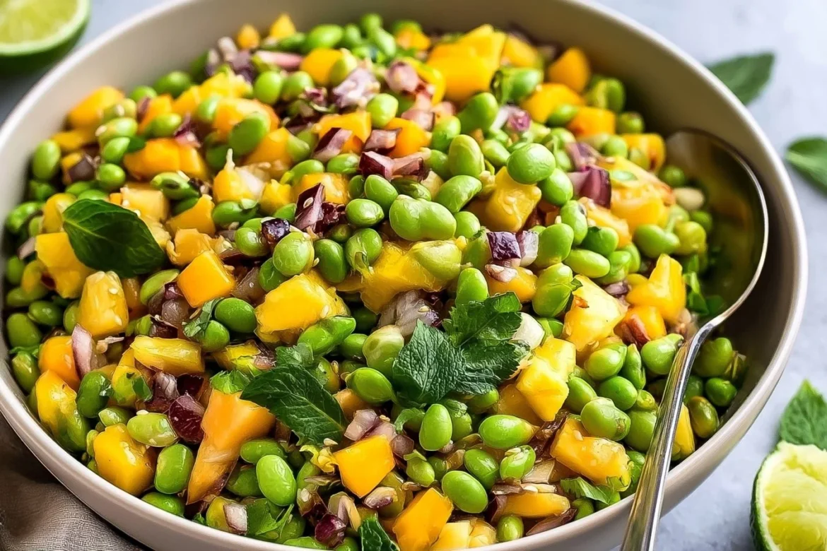 Bowl of colorful Edamame Mango Salad with fresh ingredients