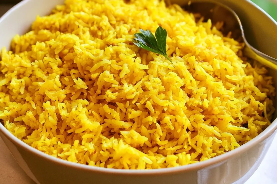 Bowl of Garlic Turmeric Rice garnished with fresh herbs