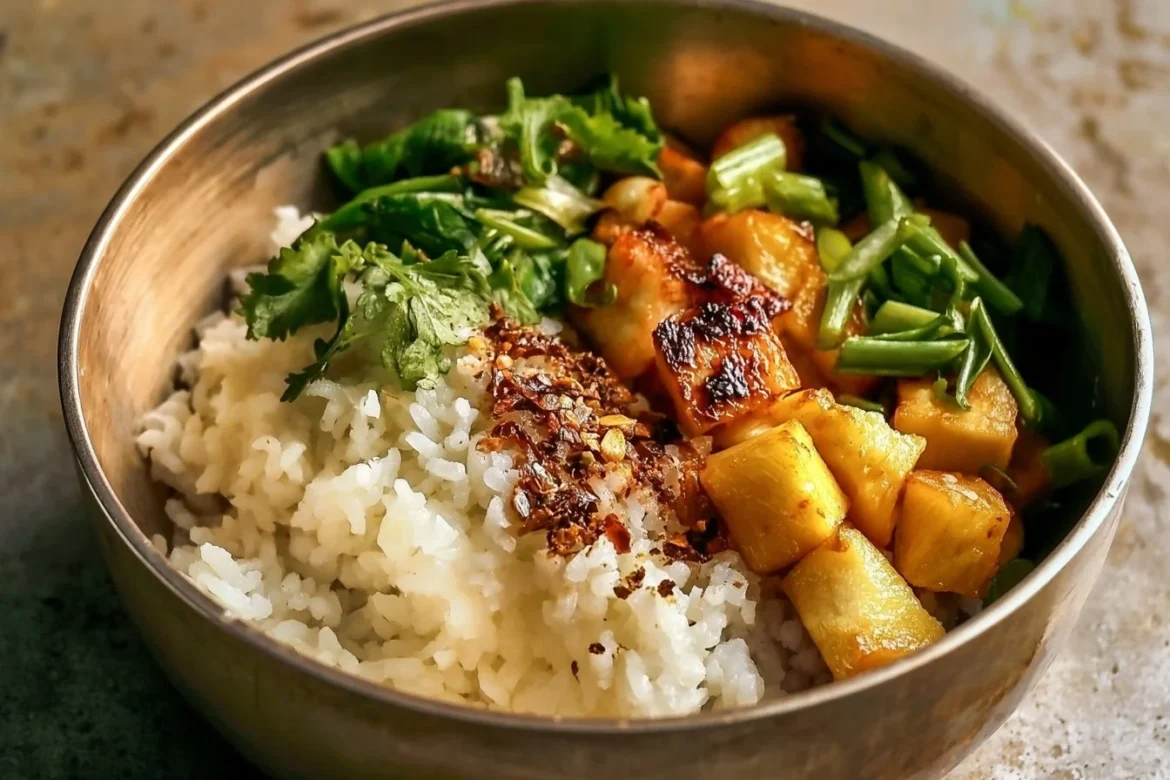 Delicious Tofu Coconut Rice Bowl with fresh vegetables and coconut sauce
