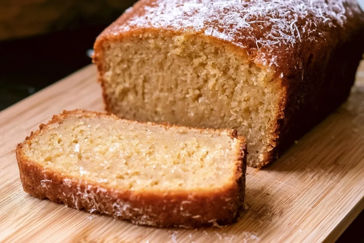 Sliced Apple Cider Pound Cake on a wooden table