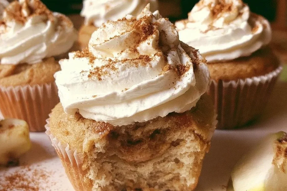 Delicious apple pie cupcakes topped with frosting and apple slices
