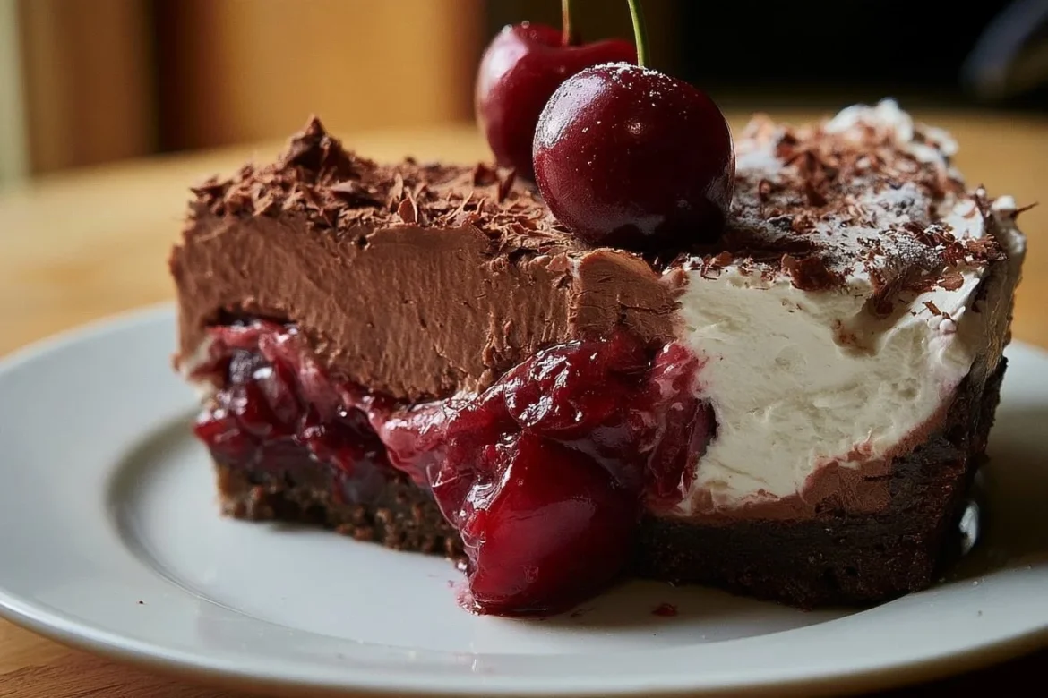 Delicious Black Forest Cherry Pie topped with whipped cream and cherries