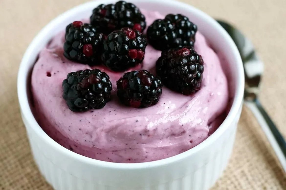 Delicious Blackberry Cheesecake Mousse topped with fresh blackberries