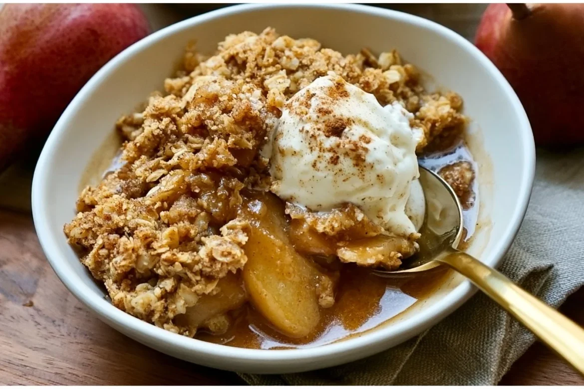 Delicious browned butter pear crisp dessert served hot with ice cream