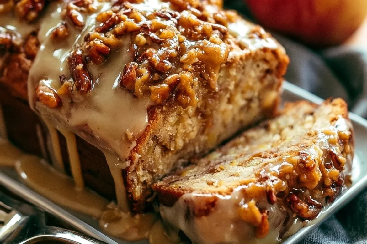 Sliced decadent praline apple bread topped with crunchy praline pieces