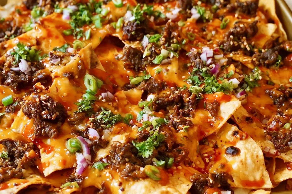 Plate of Korean Beef Nachos topped with flavorful ingredients