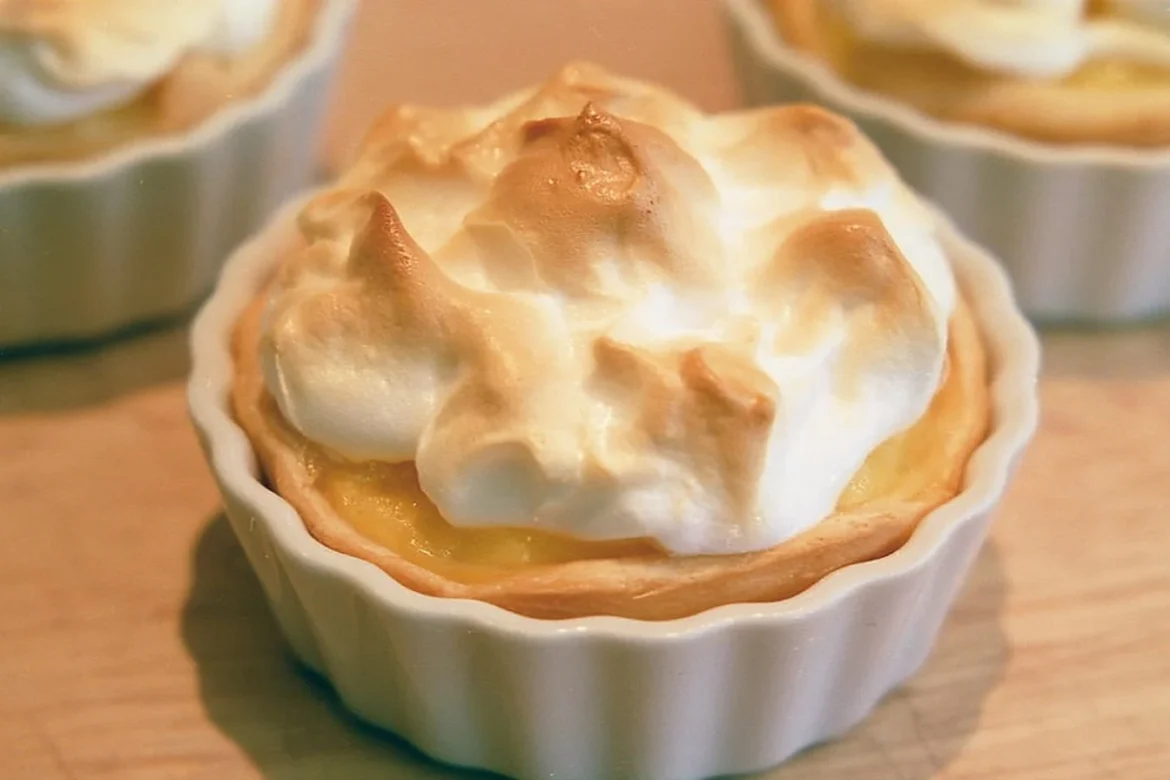 Mini crustless lemon meringue pies on a plate